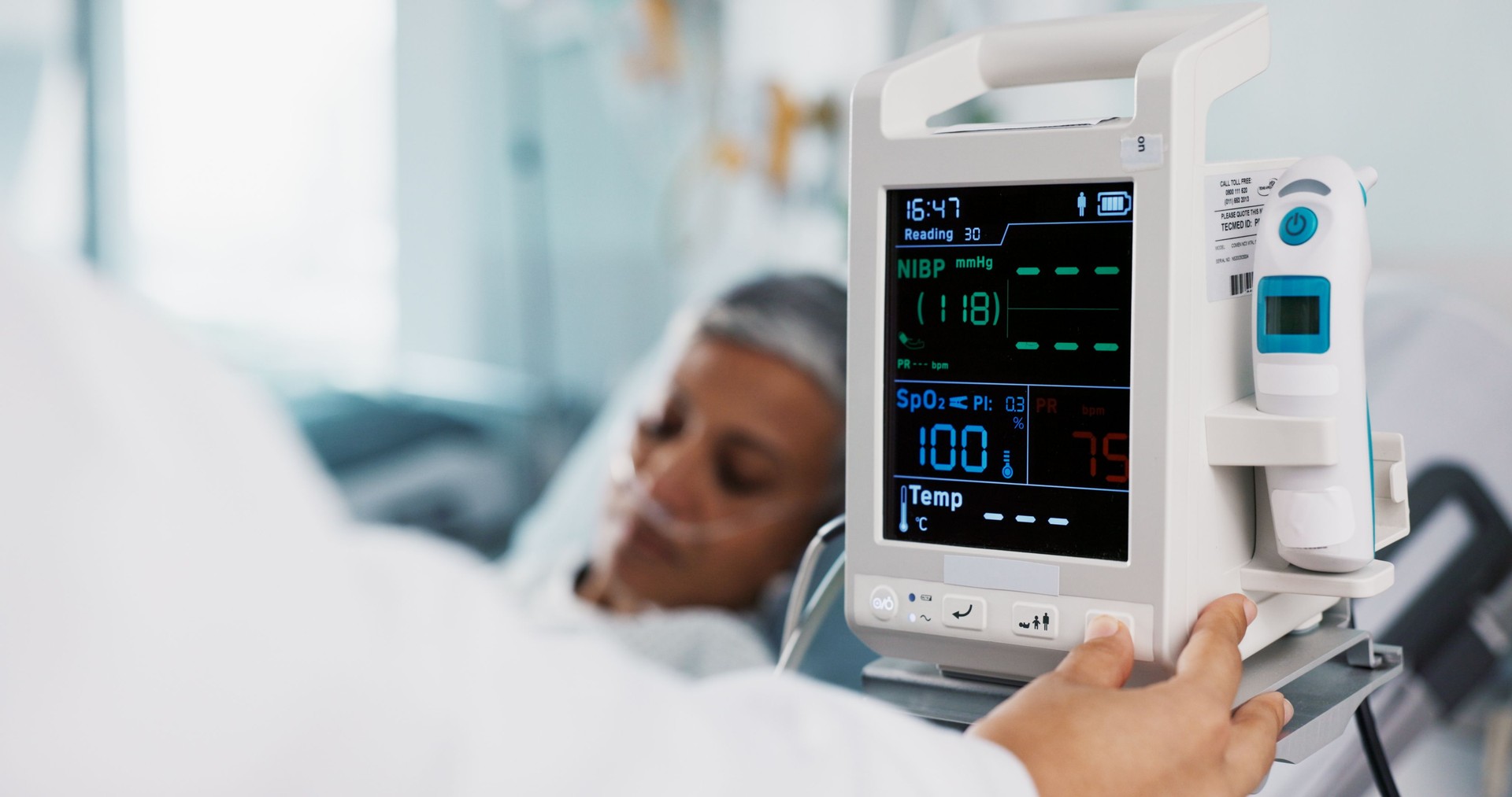 Patient, doctor and heart monitor, healthcare and help with advice, vital sign with rehabilitation in hospital. People with health numbers, screen and medical emergency, cardiology and EKG machine