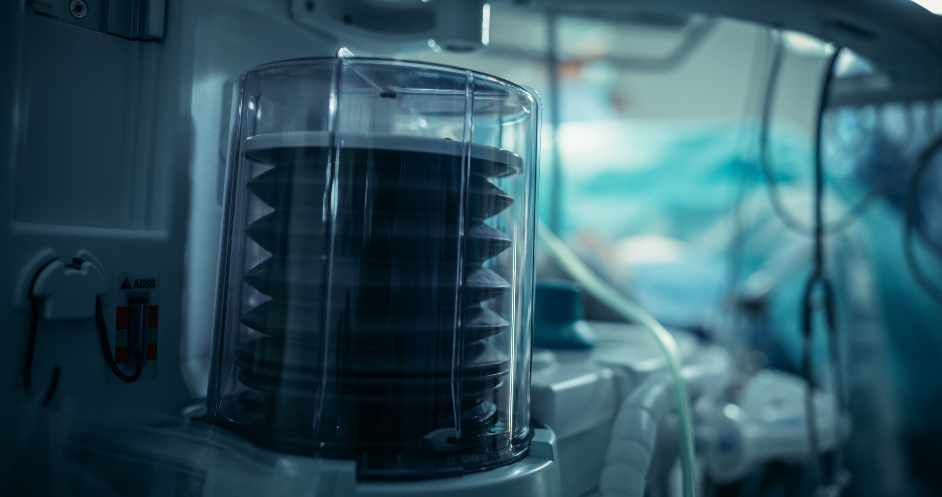 Ventilator Pump Operates Steadily in a Dimly Lit Intensive Care Room, Highlighting Essential Medical Technology in Patient Care. Scene Emphasizes Reliability in a Critical Healthcare Setting